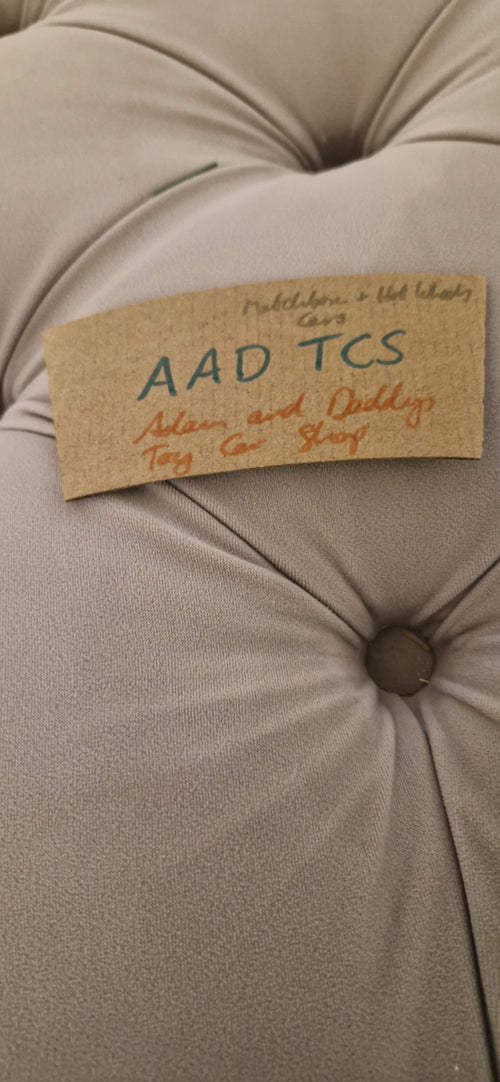 Adam And Daddy's Toy Car Shop (AADTCS)Cup holder signature on the back